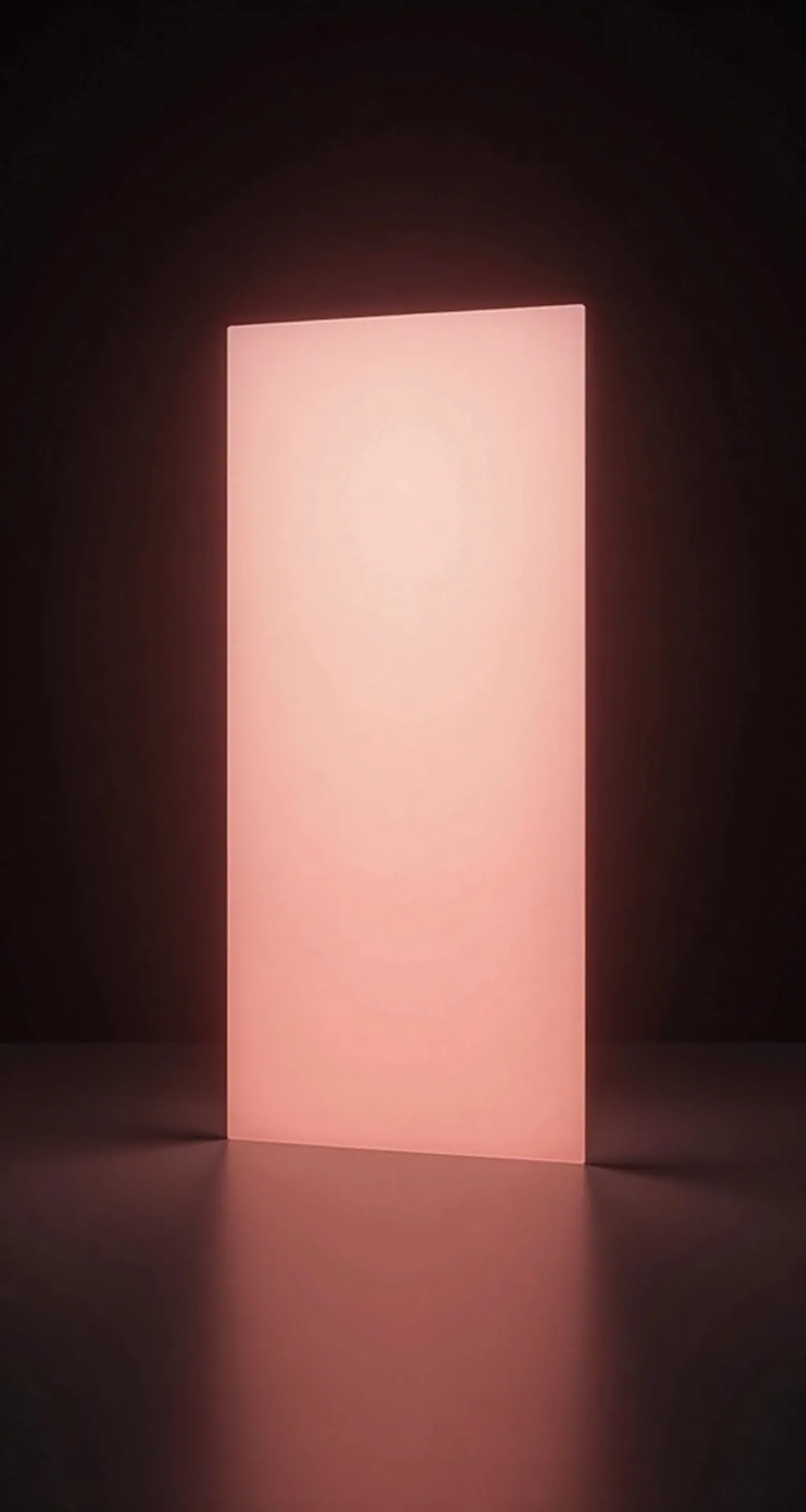 A frosted glass panel glowing coral in a dark room.