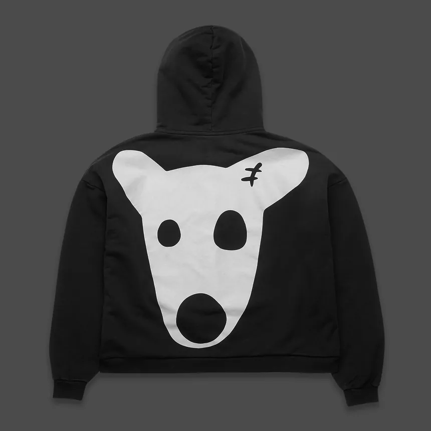A black hoodie seen from the back, Spotty’s white face filling it.
