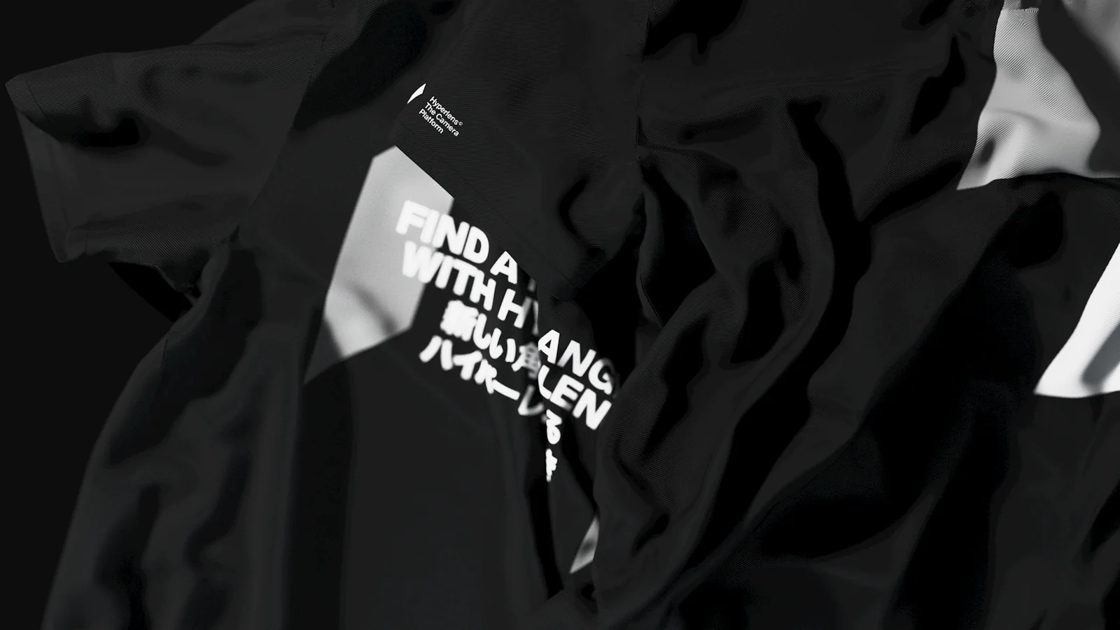 A black T-shirt printed with Find a new angle with Hyperlens.