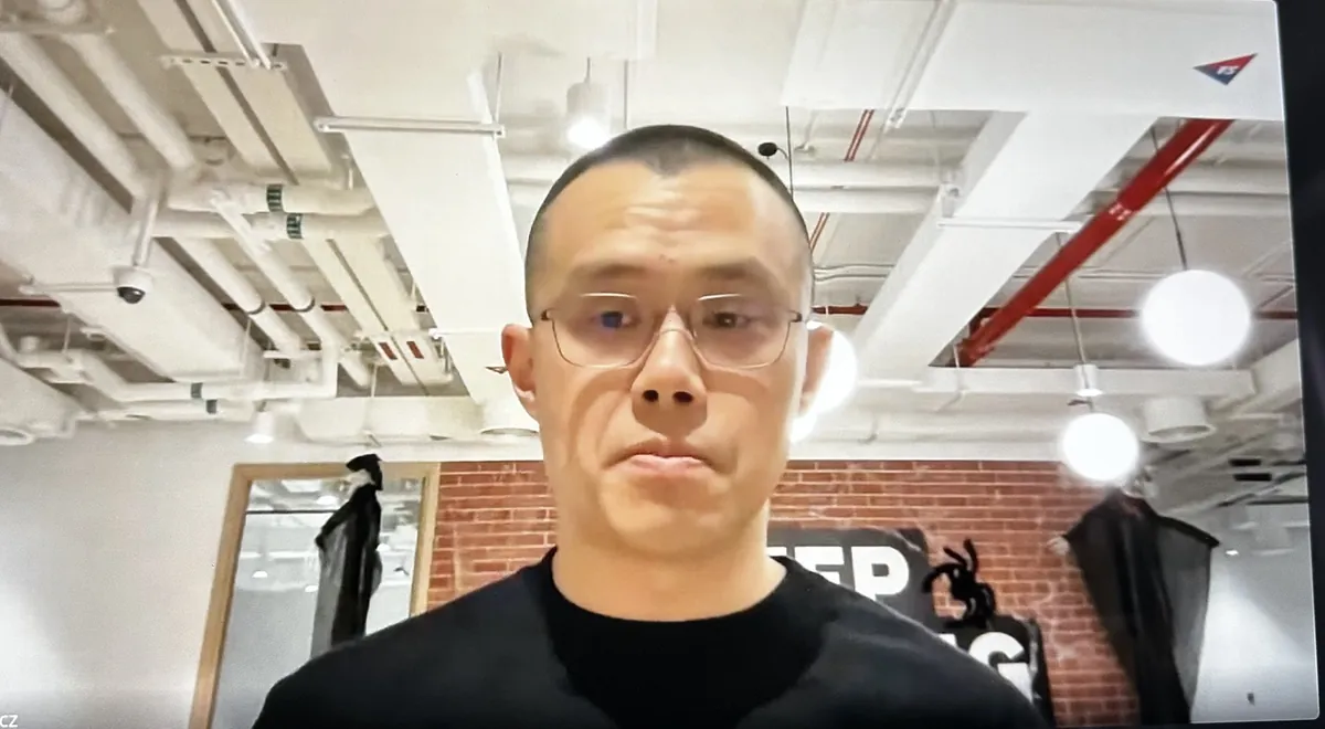 CZ speaking on a company livestream, seen on a laptop screen in October 2023.