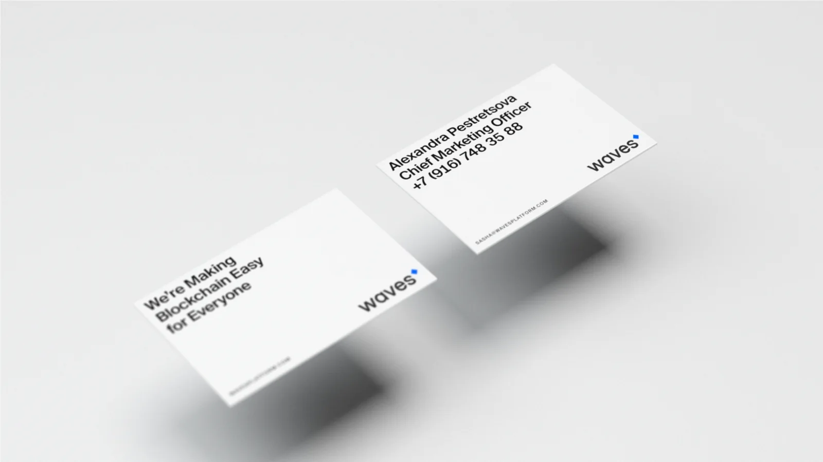 Waves business cards floating in light grey: We’re making blockchain easy for everyone.